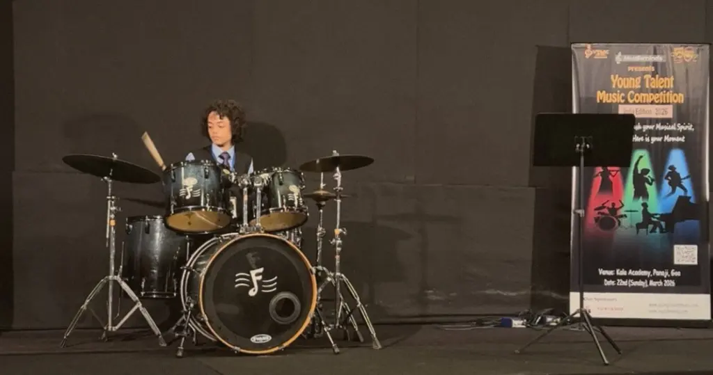 Aurum playing the drum kit on stage